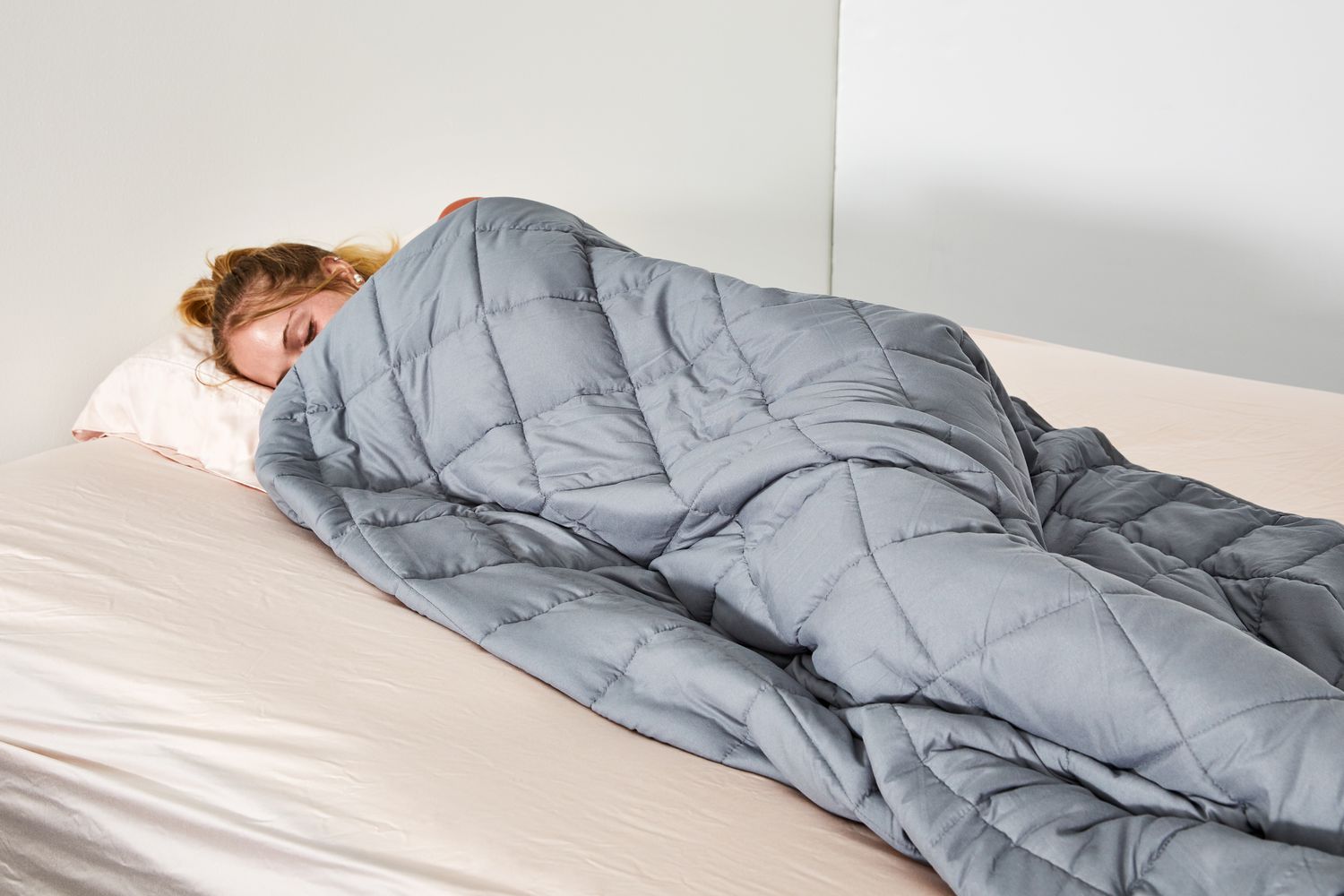 A cozy weighted blanket made with cooling cotton, perfect for improving sleep.
